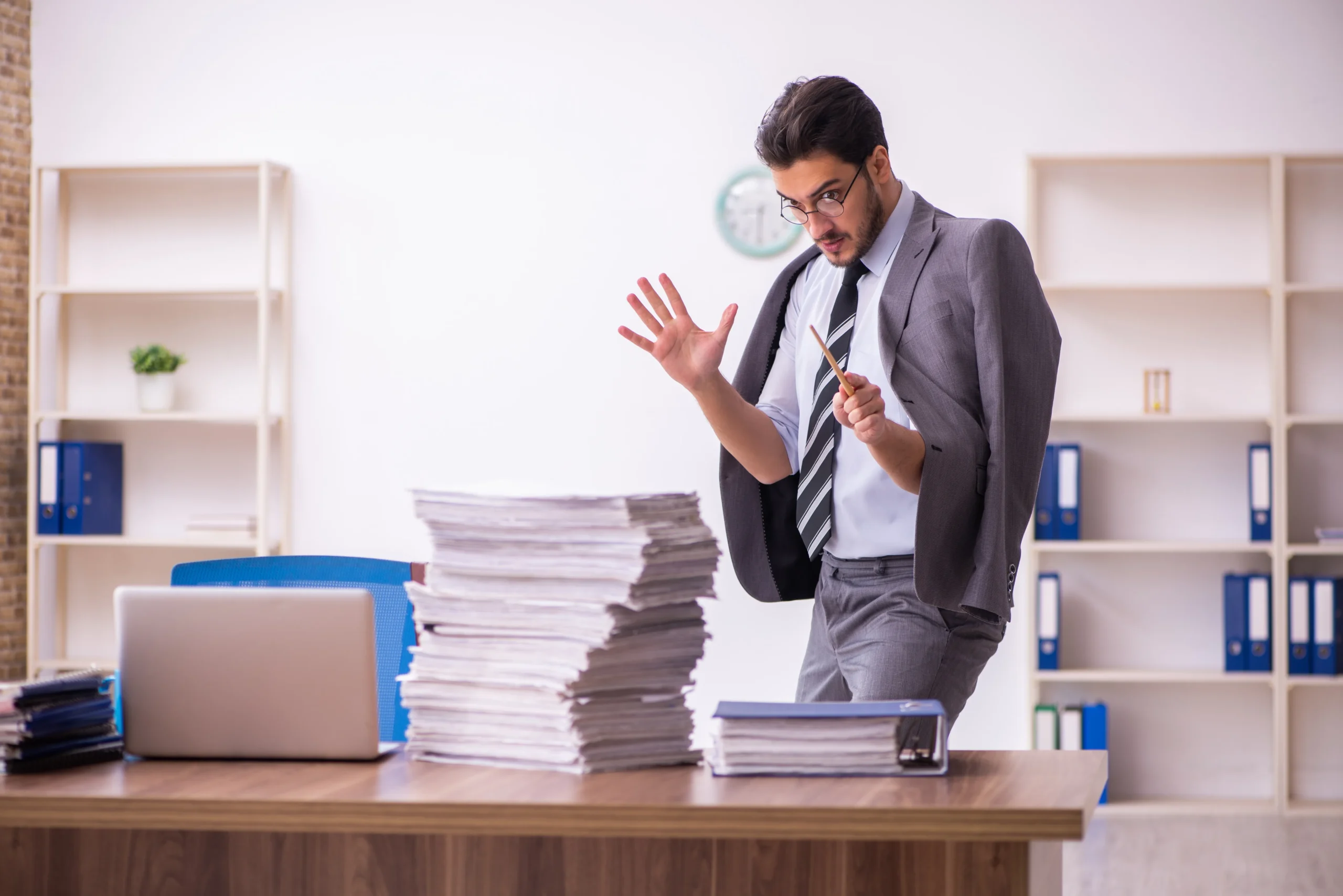 White-collar worker performs magic on a stack of templates.